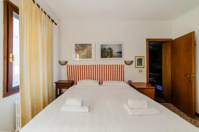 Letto o letti in una camera di Ca' Muneghe, spazioso e luminoso
