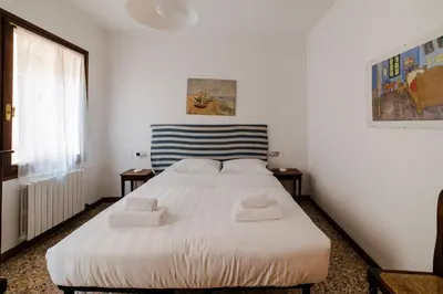 Letto o letti in una camera di Ca' Muneghe, spazioso e luminoso