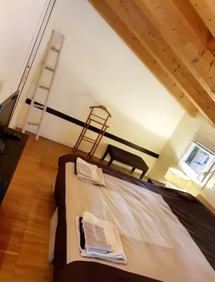 Letto o letti in una camera di Il Camino Rosso