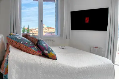 Letto o letti in una camera di dimorauno - appartamento domotico a 5 stelle