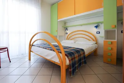 Letto o letti in una camera di Residence La Pigna