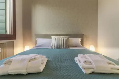 Letto o letti in una camera di enJoy Home - Bilocale sulle Riviere nel cuore di Padova