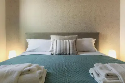Letto o letti in una camera di enJoy Home - Bilocale sulle Riviere nel cuore di Padova