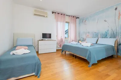 Letto o letti in una camera di Gate1-MarcoPoloAirport-3 Camere da letto-Wifi-Netflix-15' da Venezia