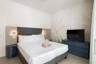 Letto o letti in una camera di Appartamento SevenAir
