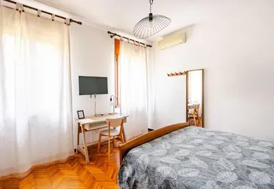 Letto o letti in una camera di The River Bank House - Casa con giardino e vista argine