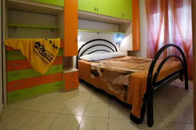 Letto o letti in una camera di Palazzina Elvira