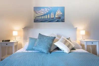 Letto o letti in una camera di enJoy Home - Attico con idromassaggio e garage - zona Sant'Antonio