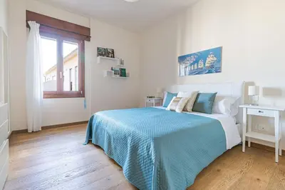 Letto o letti in una camera di enJoy Home - Attico con idromassaggio e garage - zona Sant'Antonio