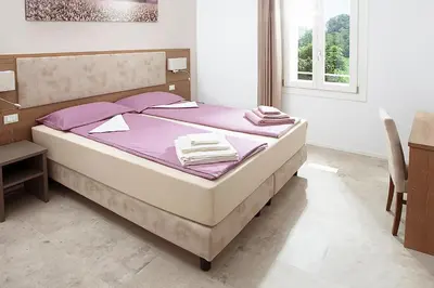 Letto o letti in una camera di Al Reparo