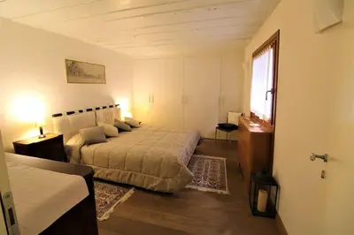 Letto o letti in una camera di San Marco charming apartment with canal view