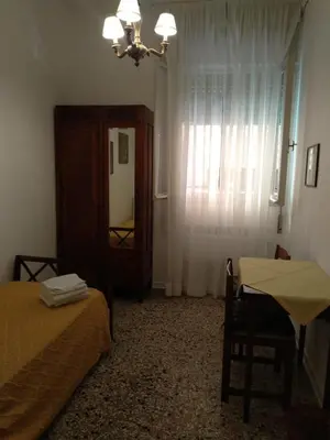 Letto o letti in una camera di Casa Gialla