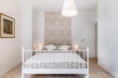 Letto o letti in una camera di GuestHost - Family & Friends Rooms