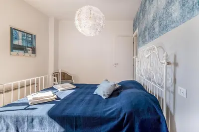 Letto o letti in una camera di GuestHost - Family & Friends Rooms