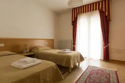 Letto o letti in una camera di Albergo Dalla Mena