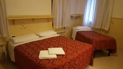 Letto o letti in una camera di Alloggi Gerotto Calderan 3