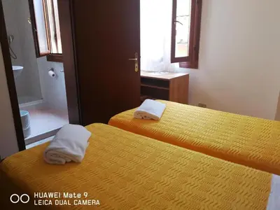 Letto o letti in una camera di Alloggi Gerotto Calderan 3