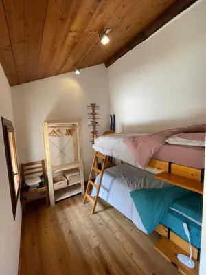 Letto o letti in una camera di Mida & Lino' s House casa rustica