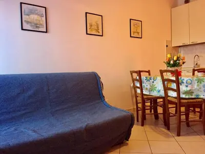 Area soggiorno di Cozy apartment with balcony-Beahost