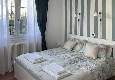 Letto o letti in una camera di Via Ellero 12