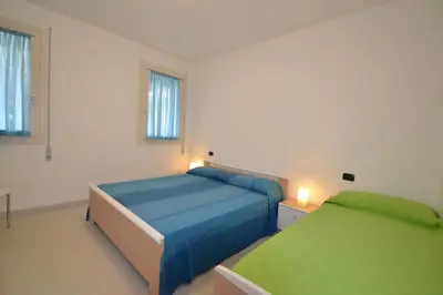 Letto o letti in una camera di Modern flat with private garden