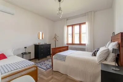 Letto o letti in una camera di Casa Cairoli