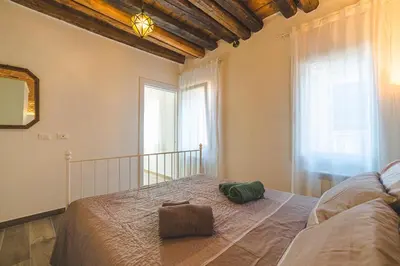 Letto o letti in una camera di Casetta Stretta Bersaglio