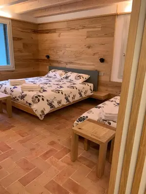 Letto o letti in una camera di Borgo Cortivi b&b
