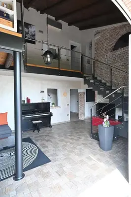 Cucina o angolo cottura di CA CENTOSA ARTISTIC HOUSE villa storica ristrutturata con patio e giardino