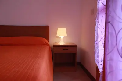 Letto o letti in una camera di Terraced house with garden and porch