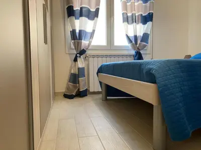 Letto o letti in una camera di Bright apartment close to the beach